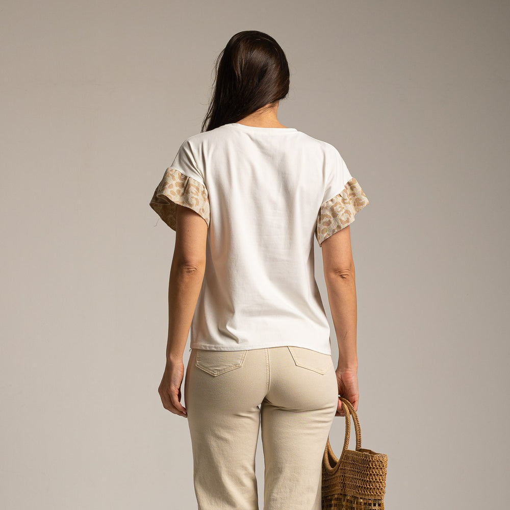Back view of white short-sleeved T-shirt with animal print ruffle detail on sleeves