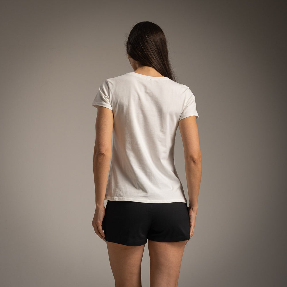 Back view of white cotton T-shirt with black shorts, minimal summer outfit