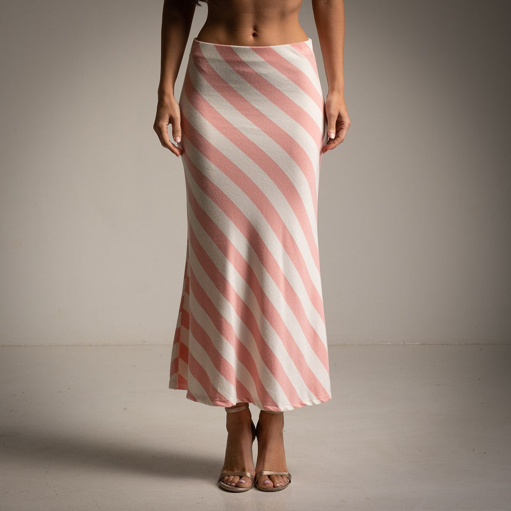 Front view of striped rose midi skirt paired with neutral heels