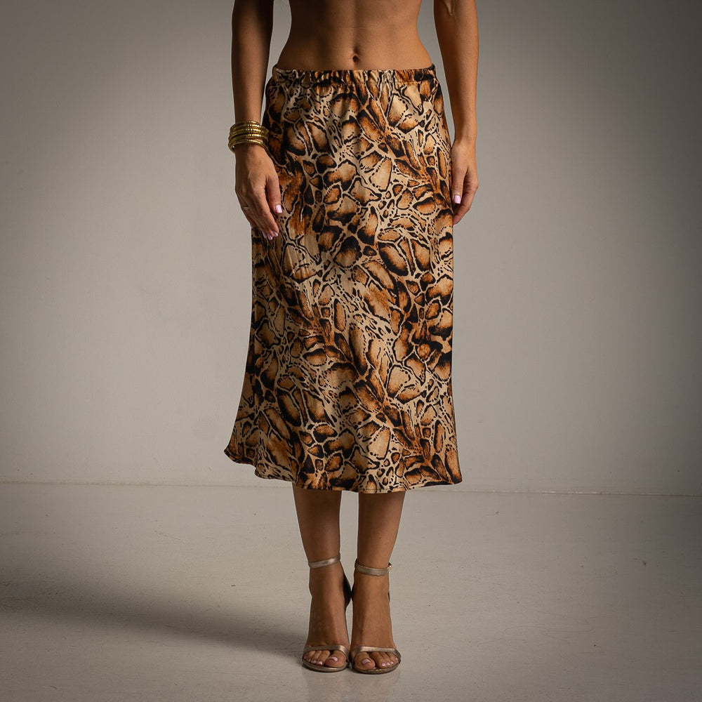 Front view of snakeskin print satin midi skirt with flowy fit and animal print details