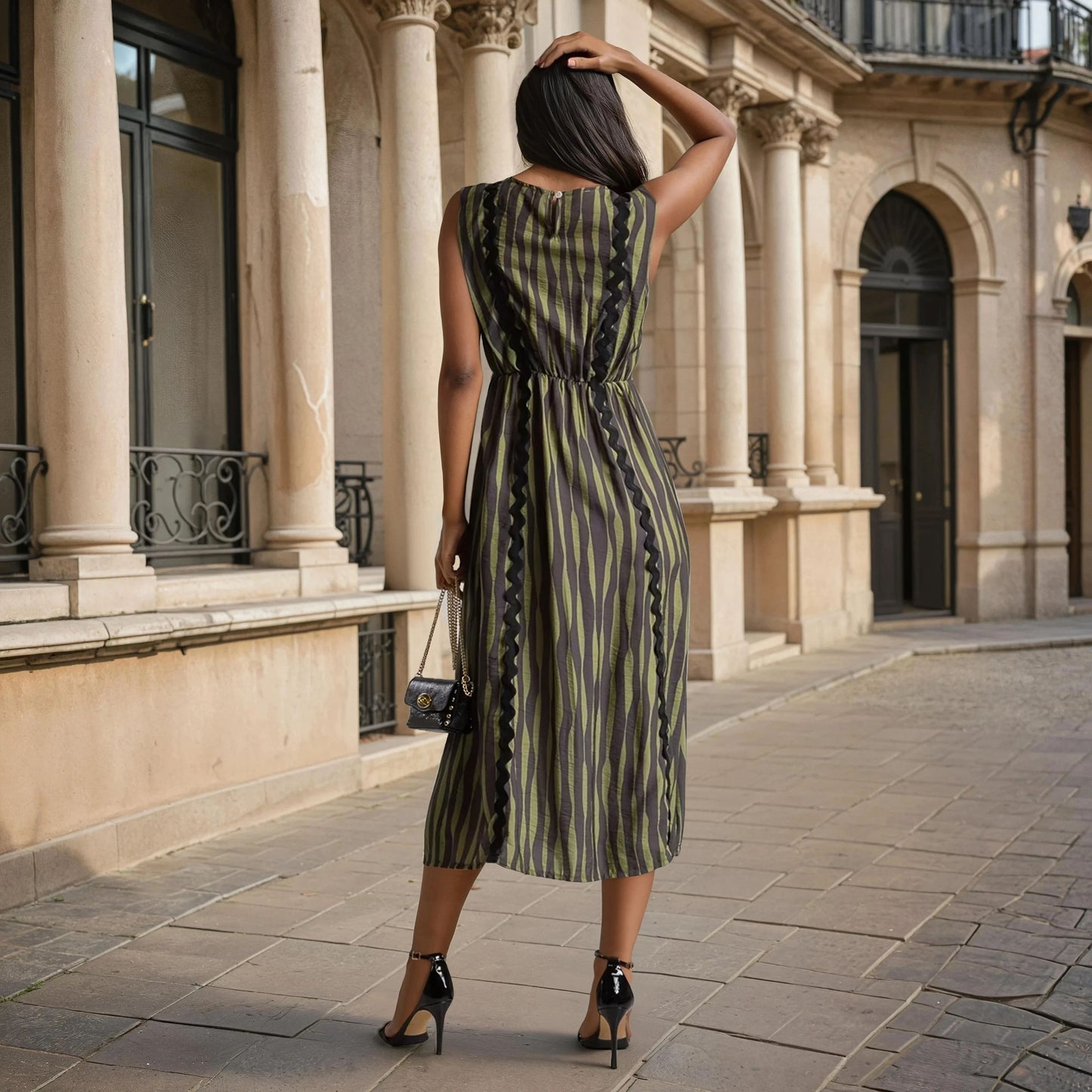 Back view of the Striped Midi Dress Camou Vibes in olive and black stripes with zigzag trim – Made in Italy, Autumn 2025 Collection.