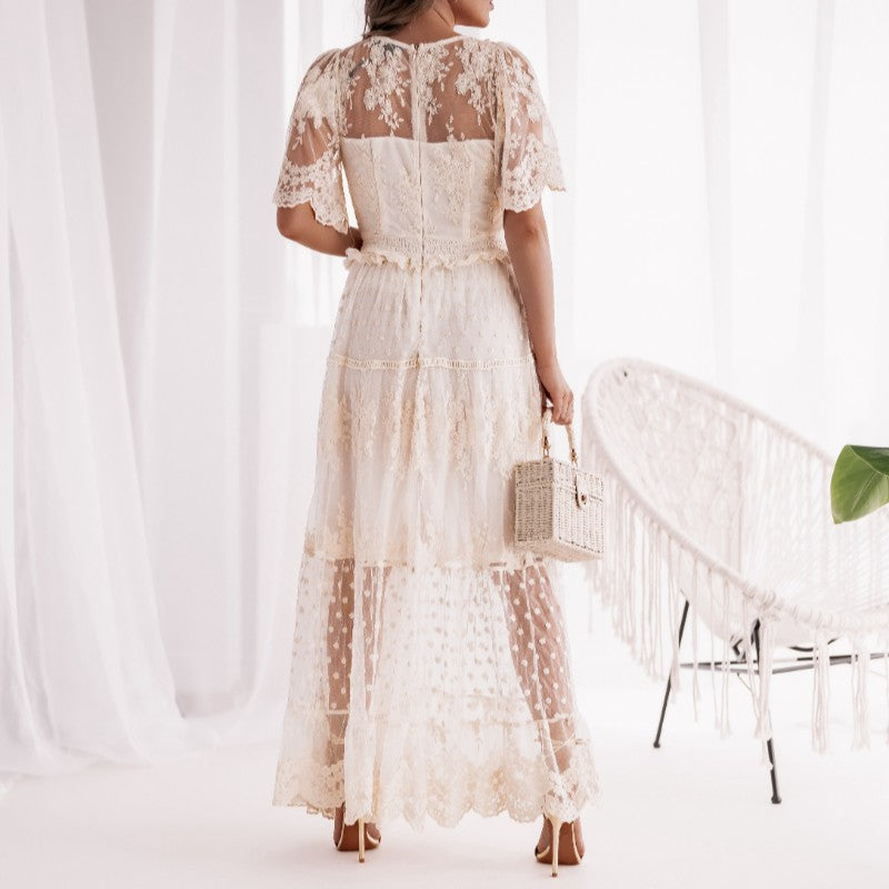 Back view of Lace Romance Maxi Dress in Soft Vanilla Cream with sheer lace panels and flowing skirt
