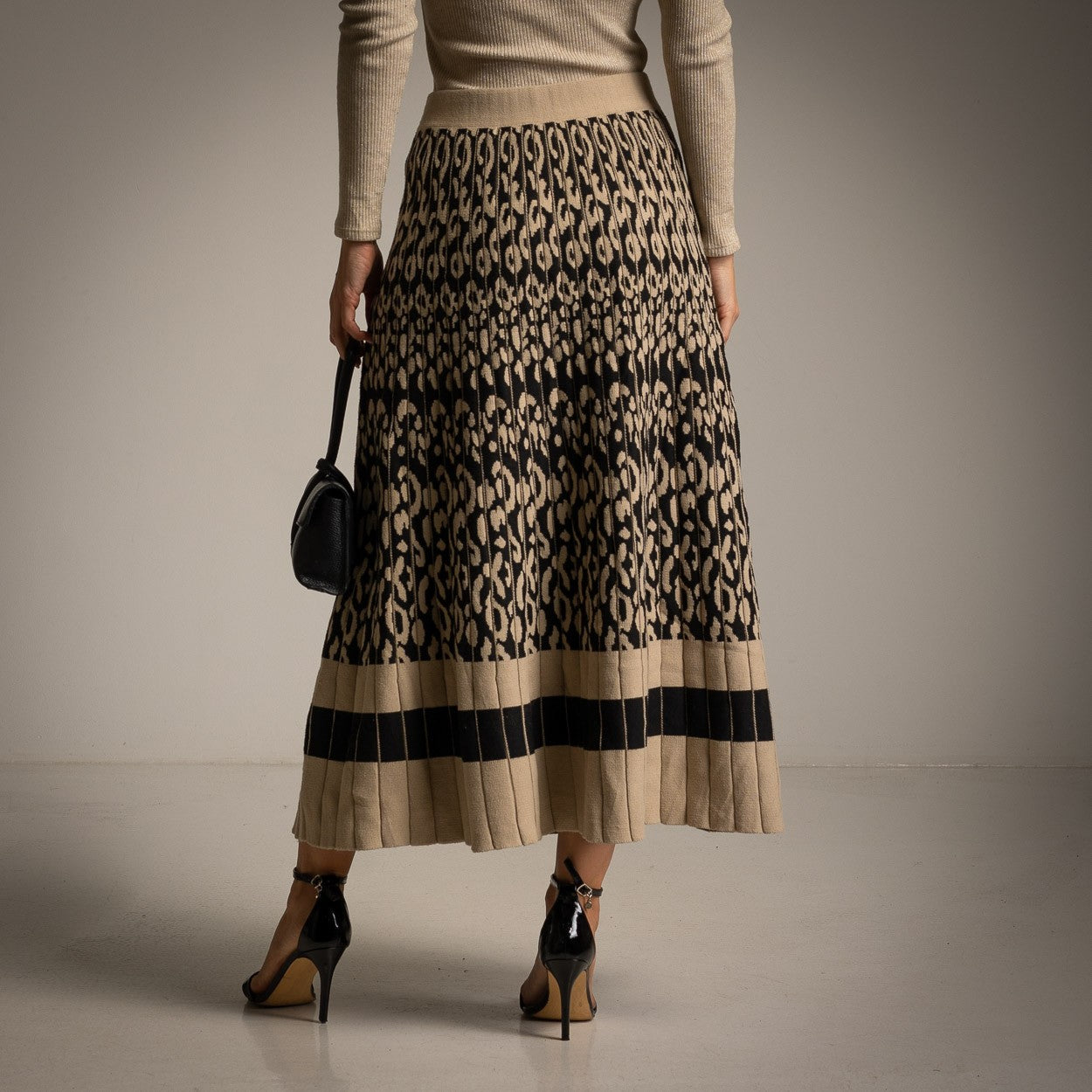 MARIΓIOÚ animal print pleated knit skirt – back studio view