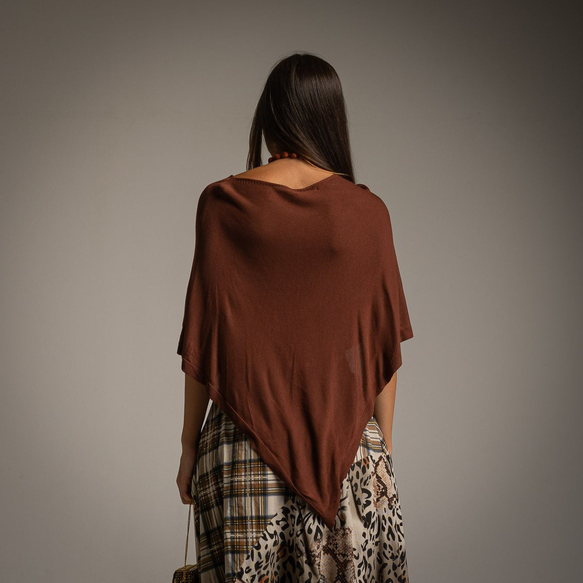 Brown asymmetric knit poncho with draped point hem - back view