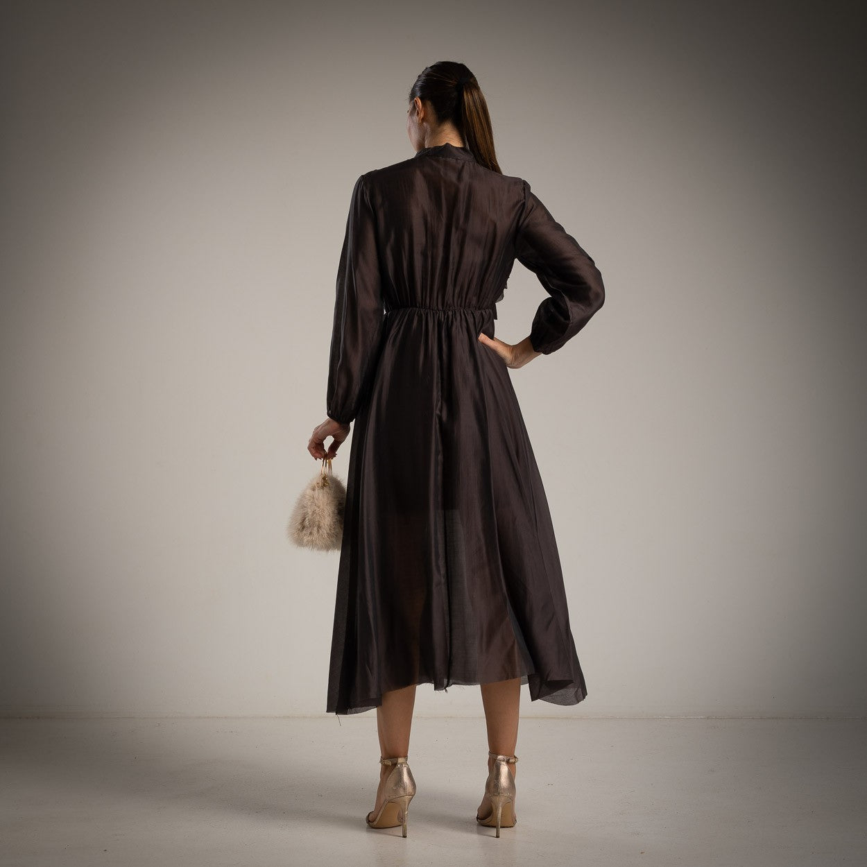 Back view of MARIΓIOÚ brown ruffled midi dress – lightweight viscose blend fabric, made in Italy.