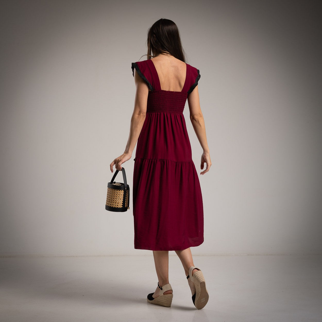 marigiou burgundy midi dress with black trim back view
