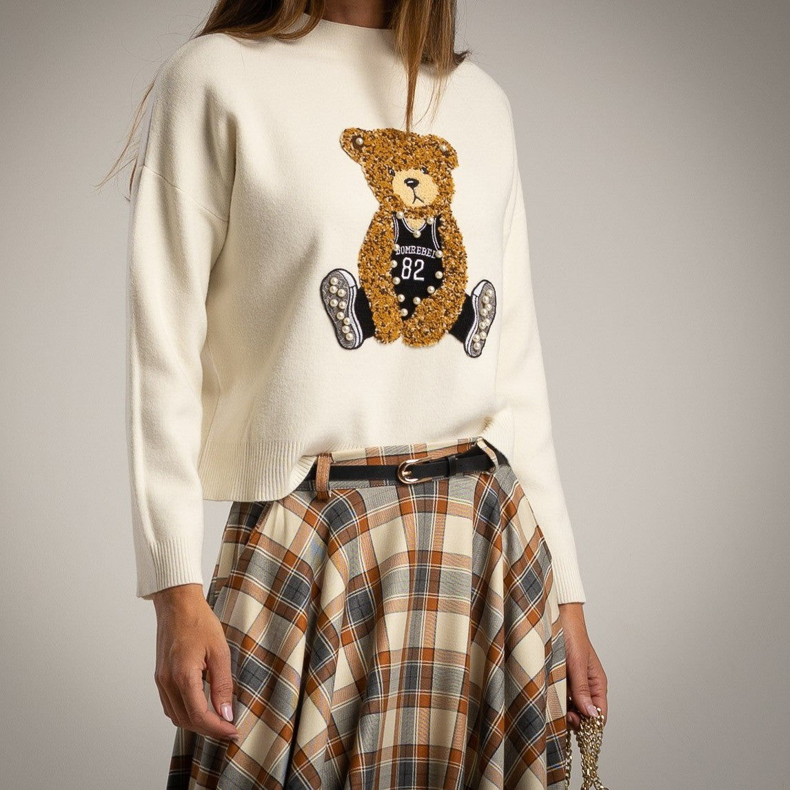 Close-up of teddy bear embroidery with bead details on creme MARIΓIOÚ sweater