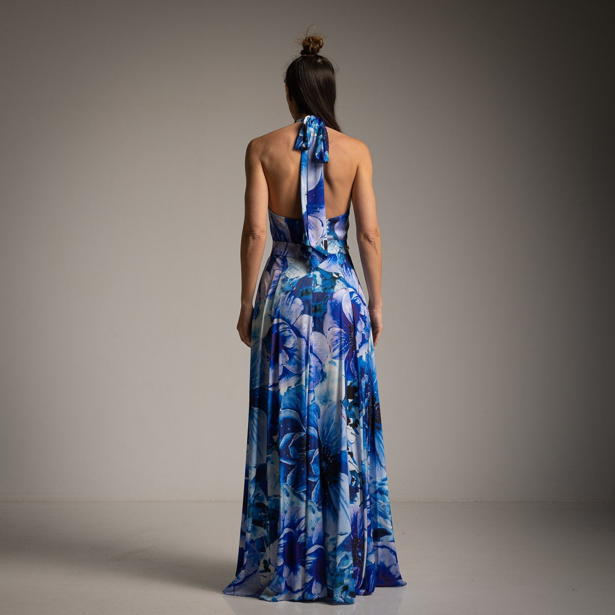 Elegant blue floral maxi dress with halter neckline and belt – back view