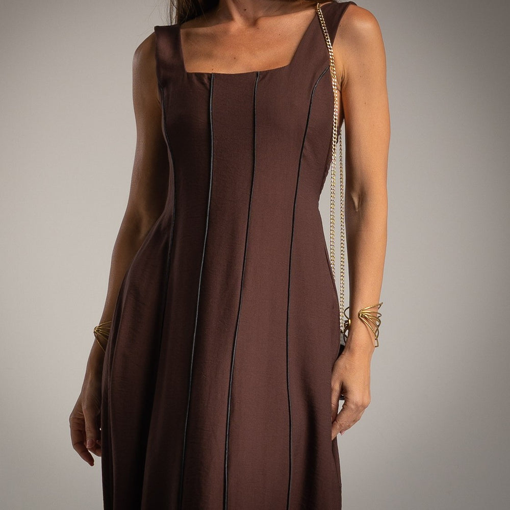 Close-up detail of MARIΓIOÚ elegant midi dress in chocolate viscose with black vertical lines