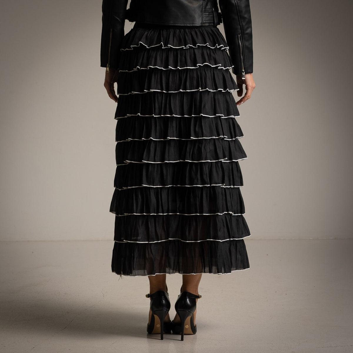 Black tiered tulle midi skirt with contrast-edged ruffles - back view