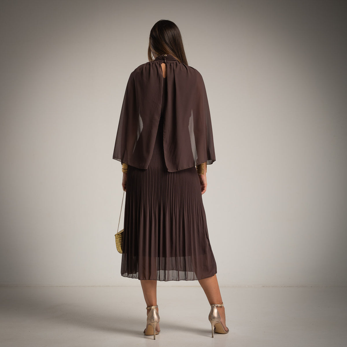 Cocoa Brown pleated midi dress with chiffon cape and high neckline - back view