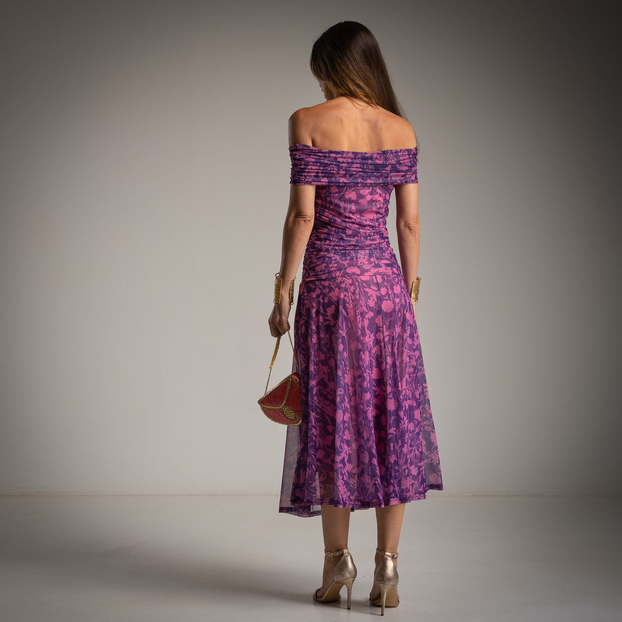 Back view of MARIΓIOÚ purple floral off shoulder midi dress