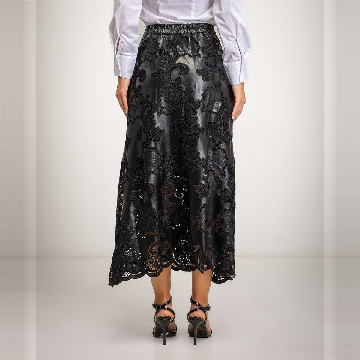 Black laser-cut floral faux leather midi skirt with scalloped hem - back view