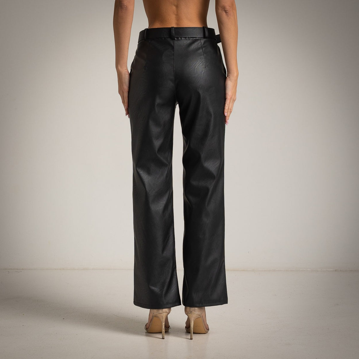 Black faux leather straight-leg pants with belt - back view