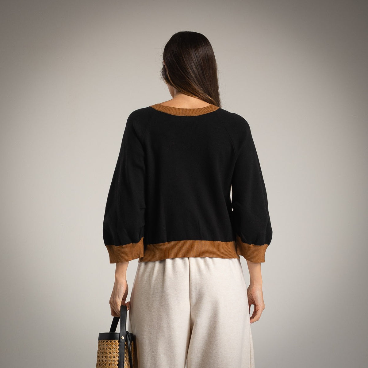 Black retro jacquard V-neck sweater with caramel contrast trims - back view