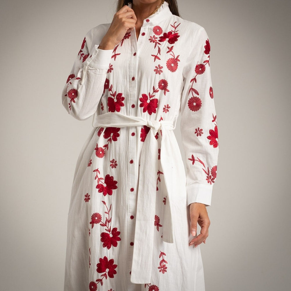 Close-up of embroidered cotton dress with red floral details – MARIΓIOÚ