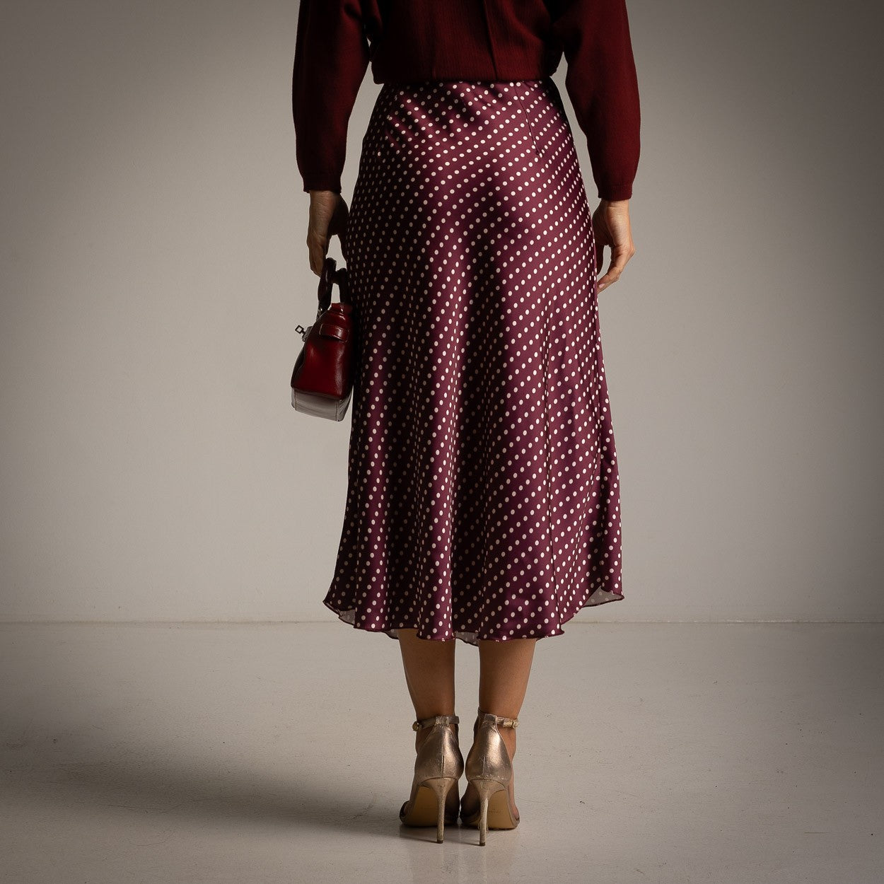 Deep Wine Red polka dot satin midi skirt with a softly flared cut - back view