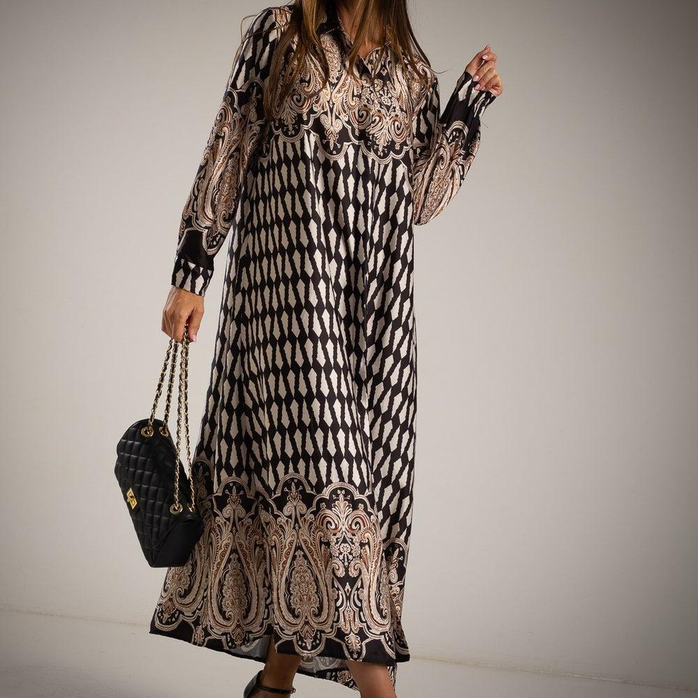 Close-up of black oversized maxi dress with beige baroque details | MARIΓIOÚ