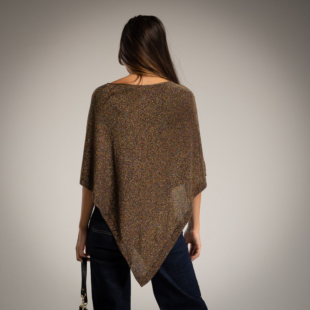 Brown asymmetric lurex poncho with shimmering metallic knit - back view