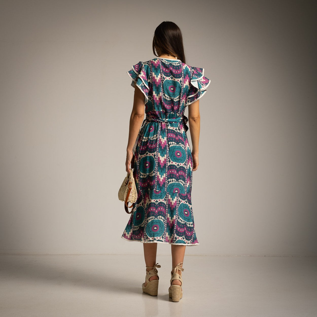 Back view of Ocean Mosaic Mediterranean wrap midi dress with ruffle sleeves