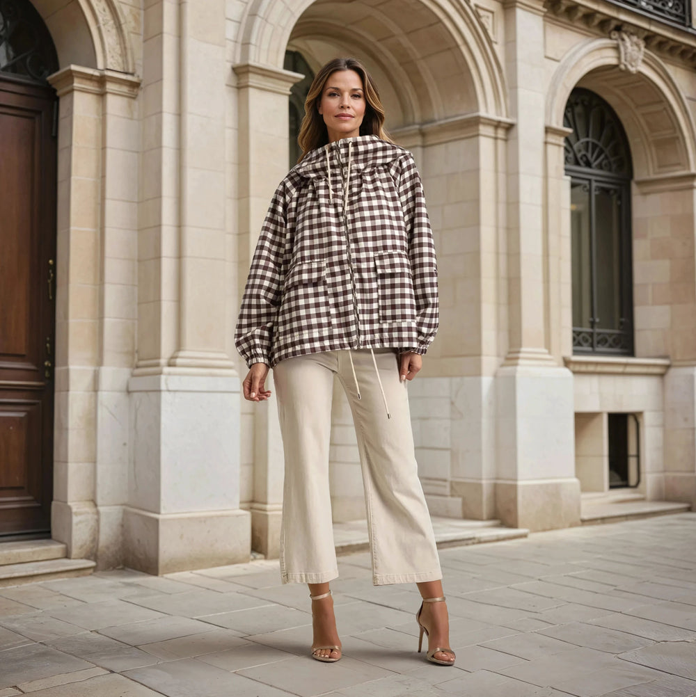 Full outfit with oversized gingham windbreaker jacket styled with beige trousers – MARIΓIOÚ