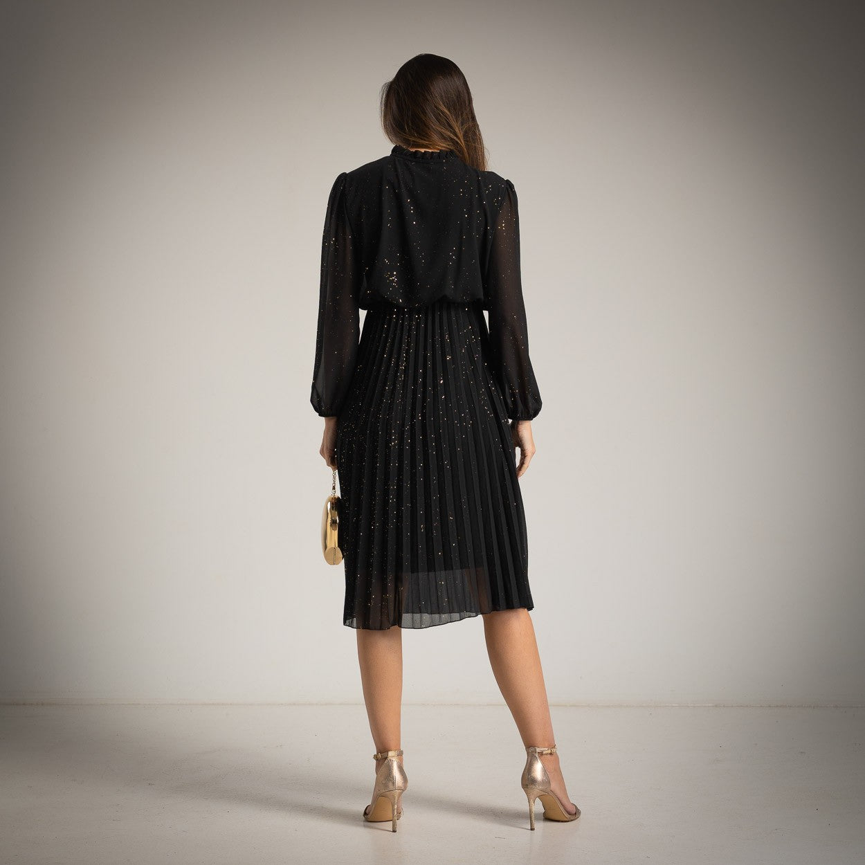 Black glitter pleated midi dress by MARIΓIOÚ, back view
