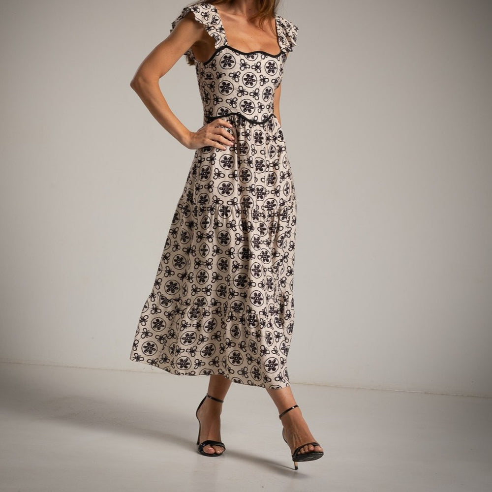MARIΓIOÚ retro midi dress in cream with black floral pattern, 100% viscose – side view