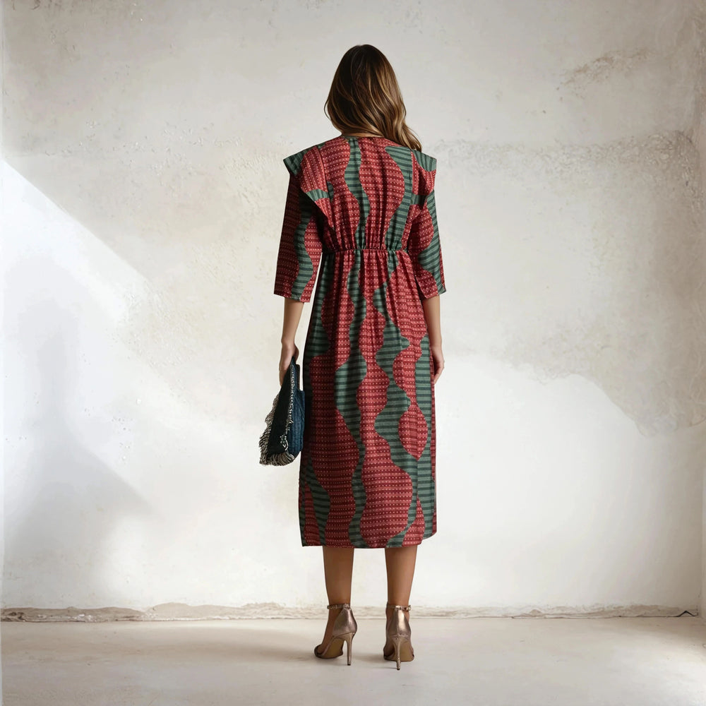 Back view of MARIΓIOÚ midi dress with bold geometric print in green and red, Made in Italy
