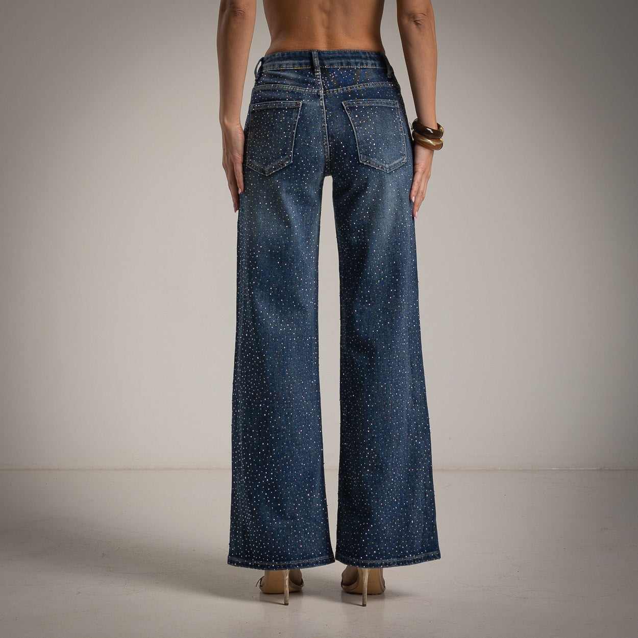 Back view of rhinestone wide leg jeans in dark blue by MARIΓIOÚ