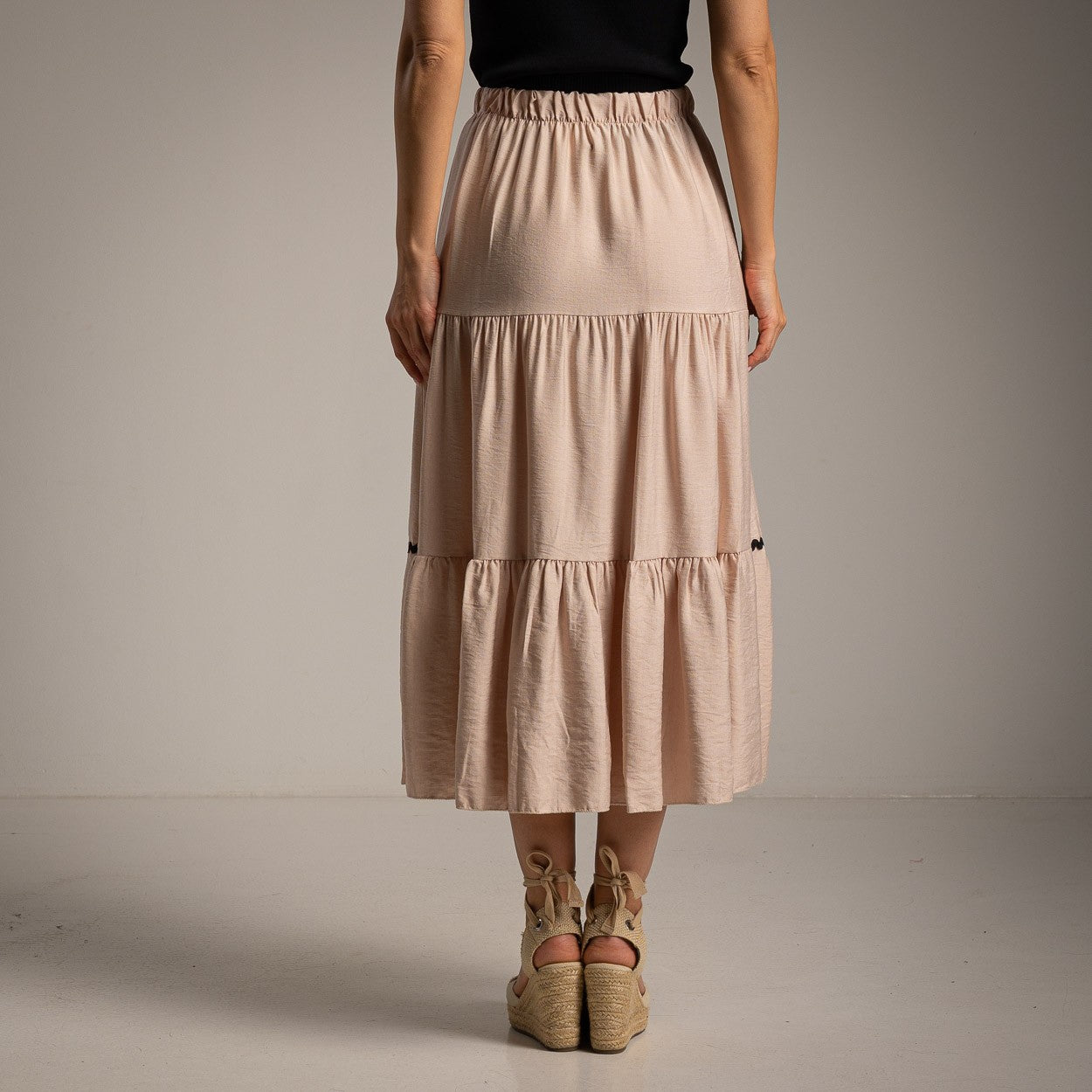 Soft sand beige flowy midi skirt with elastic waist back view