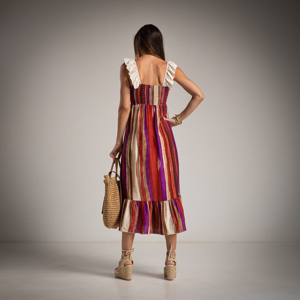 Back view of MARIΓIOÚ striped pink midi dress with feminine ruffle straps and flowy hemline