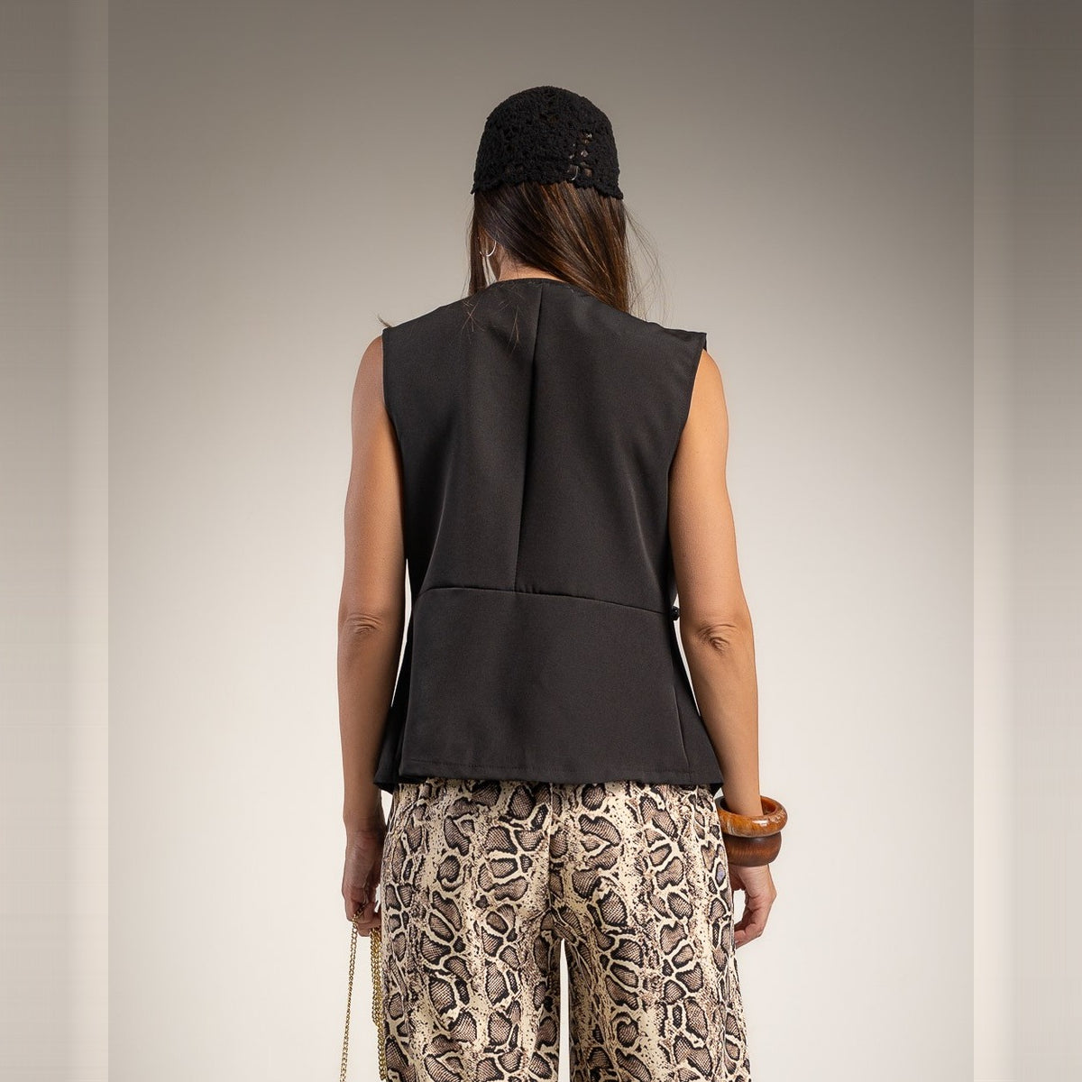 Black sleeveless military braid vest with gold buttons - back view