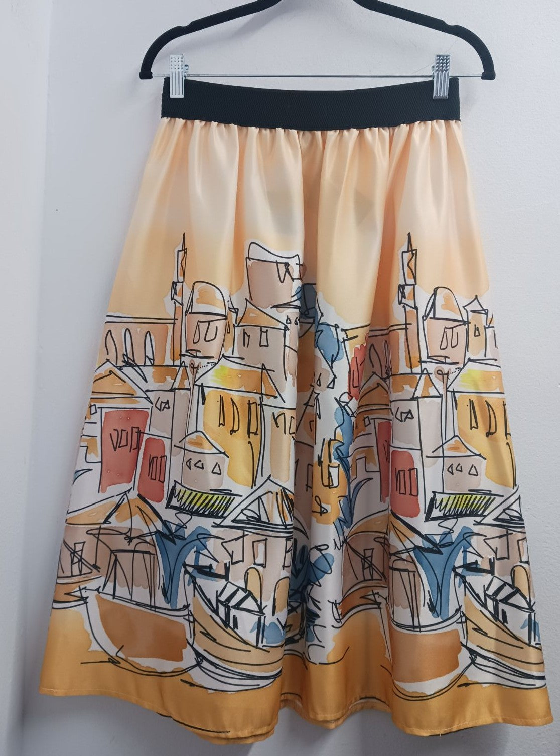 MARIΓIOÚpastel yellow graphic city print midi skirt back view flared shape