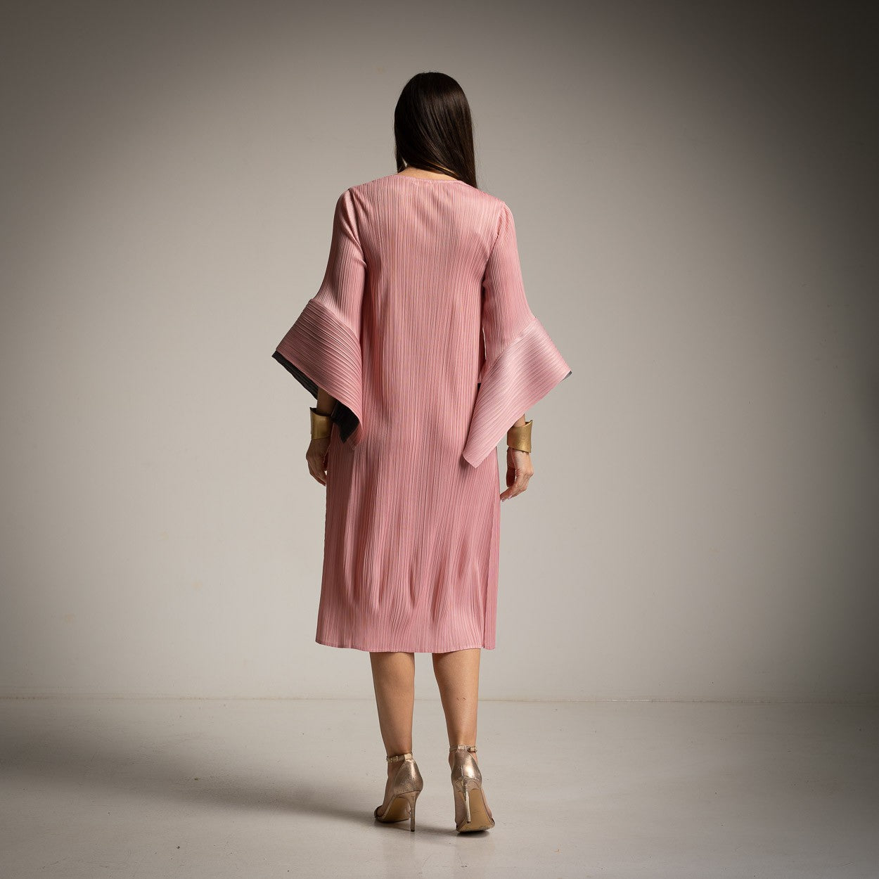 Micropleated one size dress back view with elegant pleats