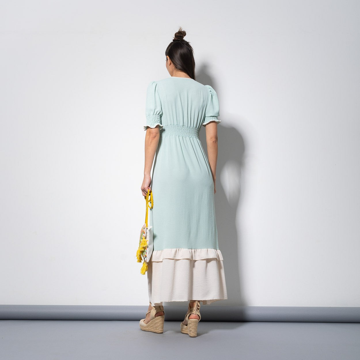 Romantic mint midi summer dress with V-neck and puff sleeves, back view with smocked waist