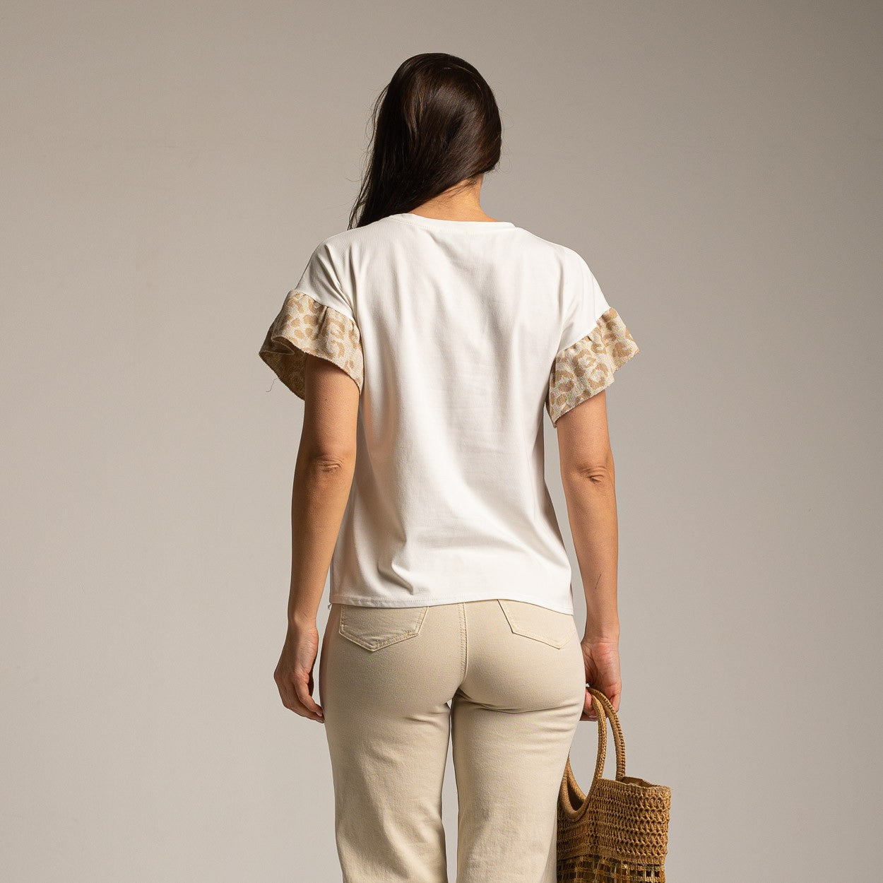 White cotton T-shirt back view with leopard print sleeves studio photography