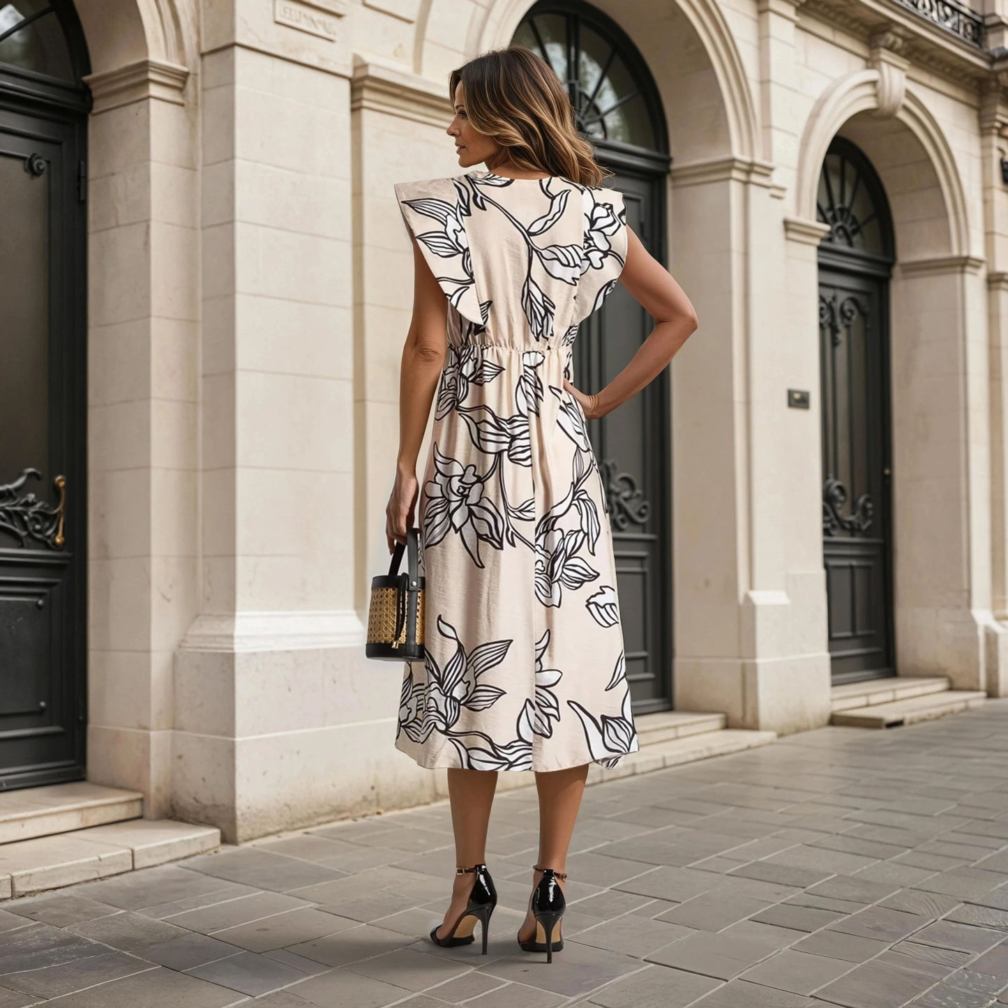 Back view of the Midi Floral Statement Dress in beige with black oversized floral print – 100% viscose, Autumn 2025 Collection.
