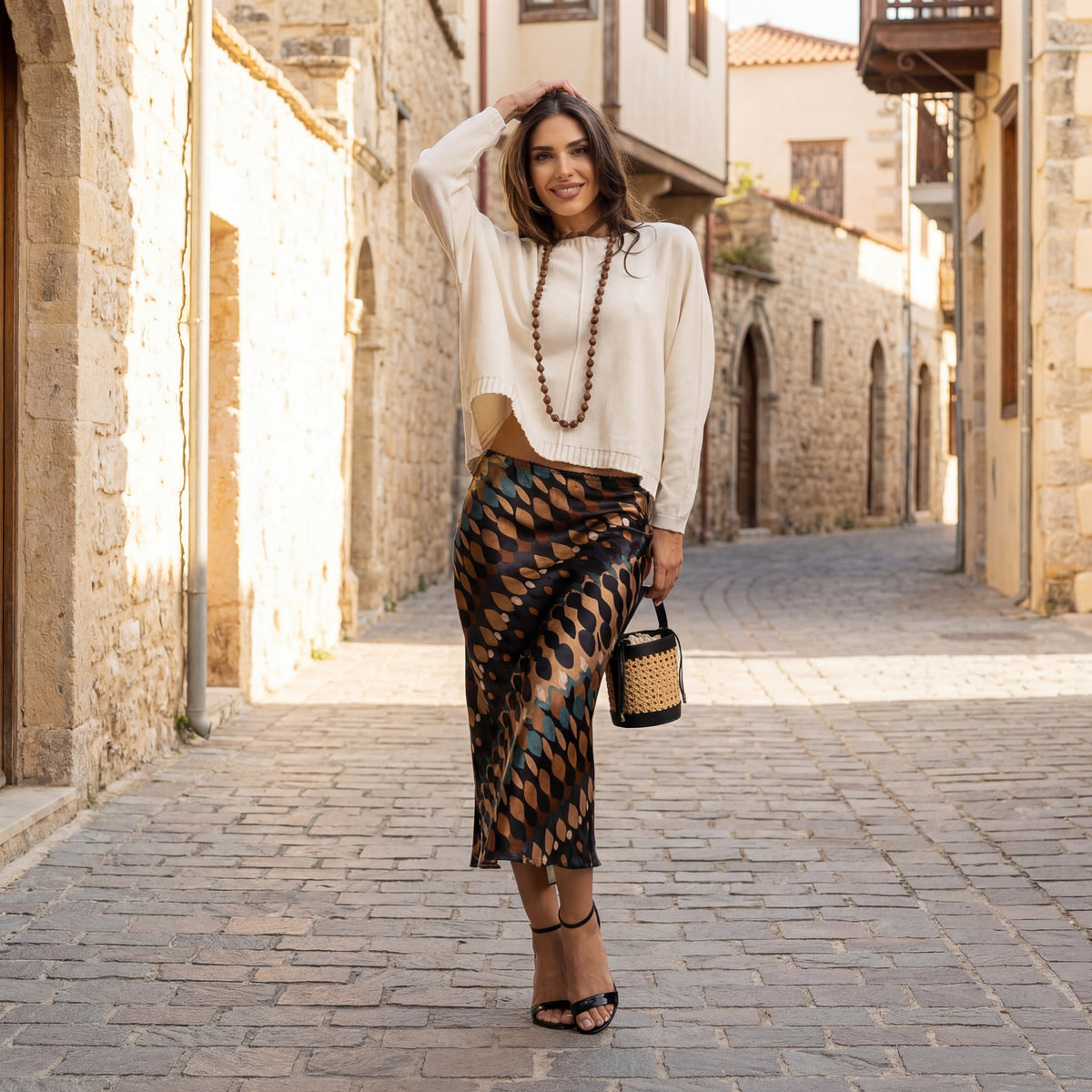 Abstract pattern midi skirt styled in Mediterranean street setting