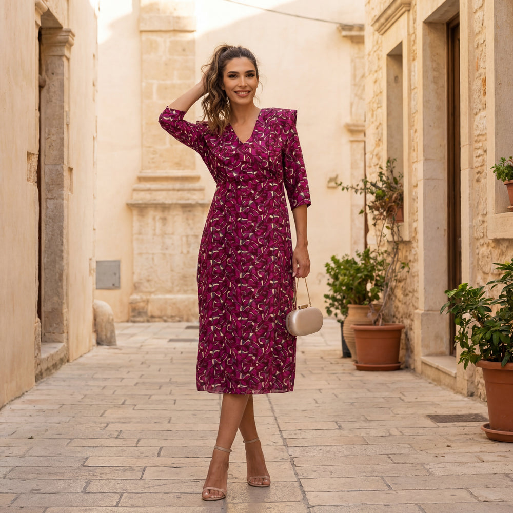 Elegant autumn print midi dress with a feminine silhouette styled in a refined streetstyle look