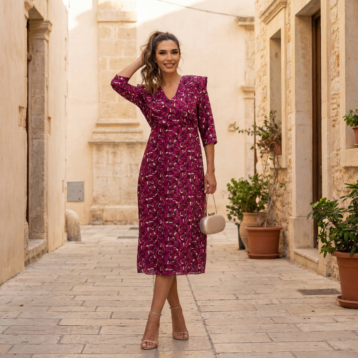 Elegant autumn print midi dress with a feminine silhouette styled in a refined streetstyle look