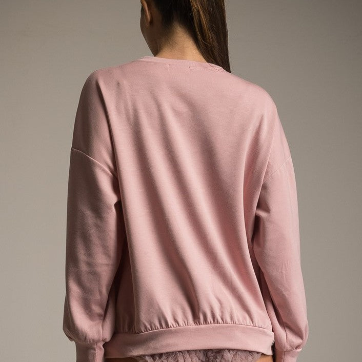 Back view of blush one size sweater with relaxed fit