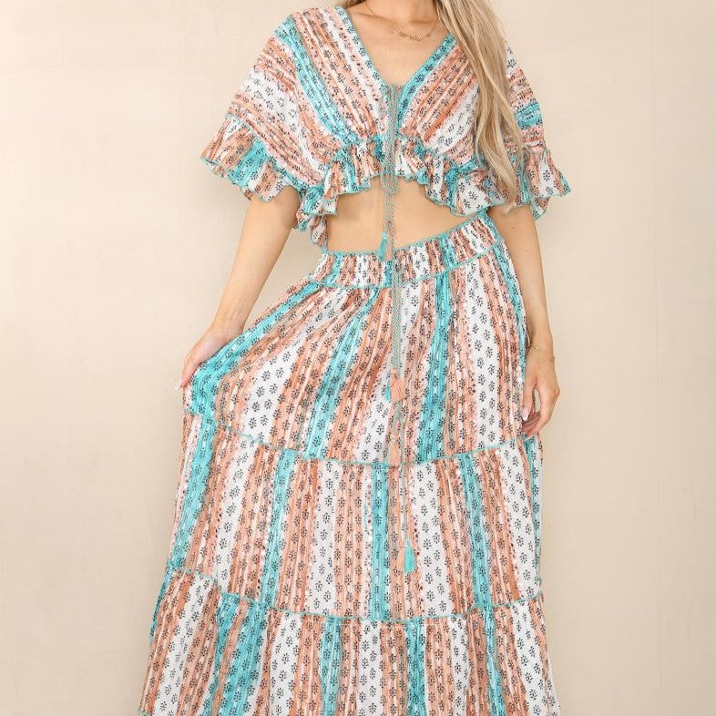 Close up of boho two piece set in turquoise with ruffle top and lightweight fabric