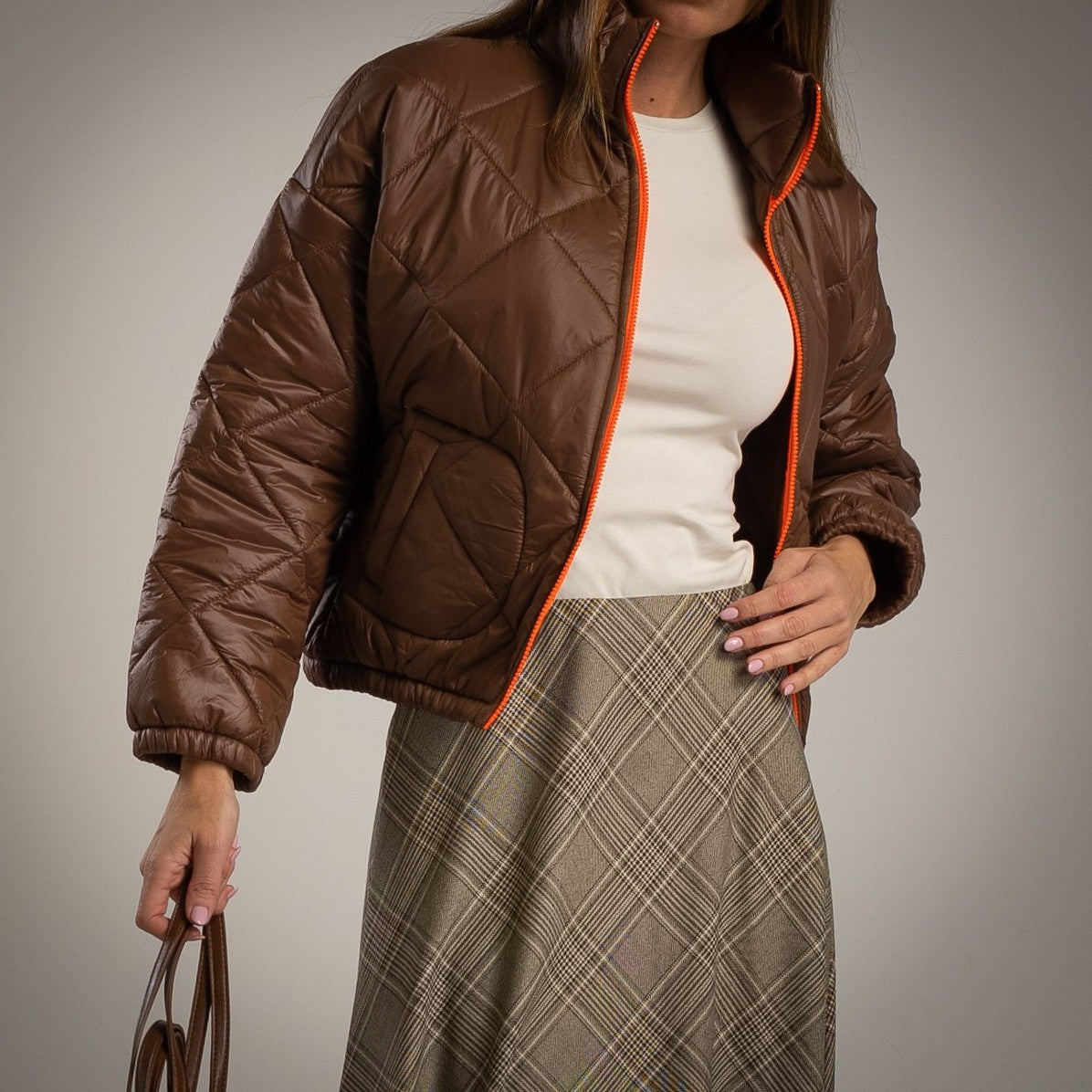 Chocolate padded jacket with fluorescent zipper – front view