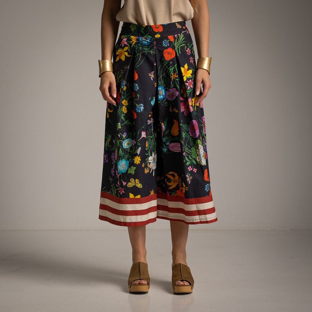 Front view of floral cotton culotte pants in Classic Black featuring a vibrant botanical print and wide-leg fit.