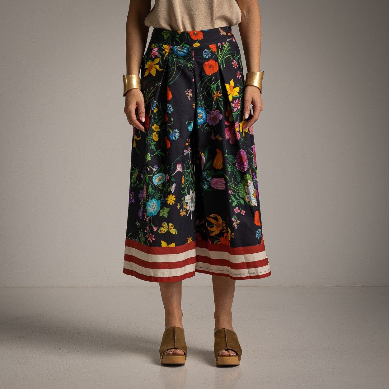 Front view of floral cotton culotte pants in Classic Black featuring a vibrant botanical print and wide-leg fit.