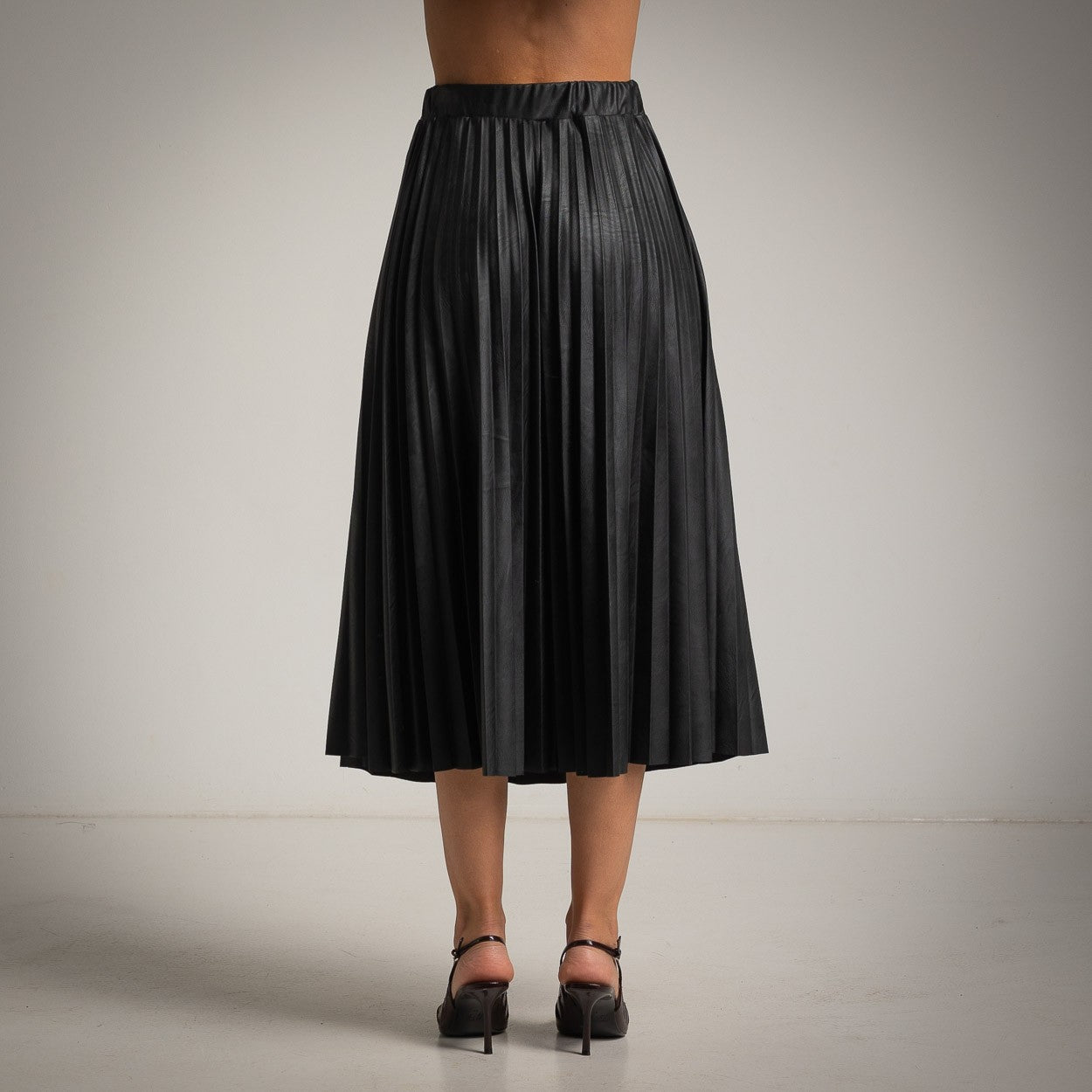Black ECO Leather pleated midi skirt back view