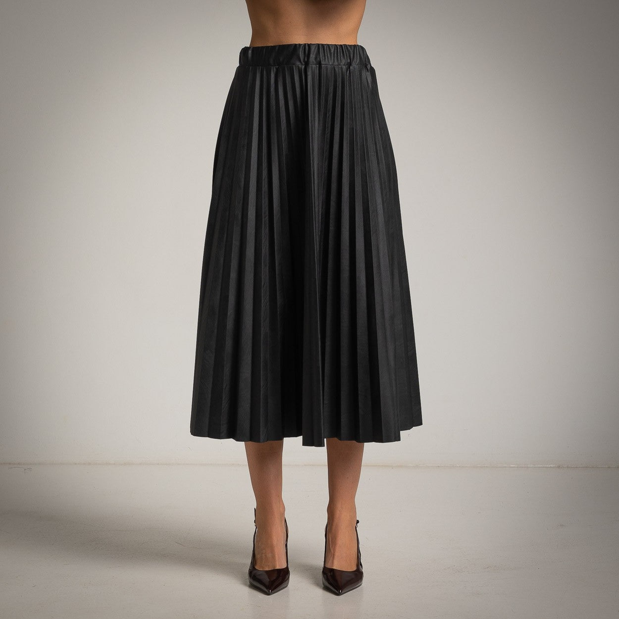 Black ECO Leather pleated midi skirt front view