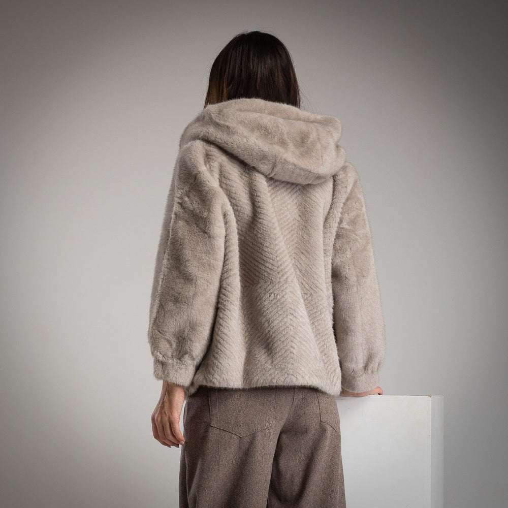 Back view of MARIΓIOÚ faux fur hooded jacket in taupe with hood detail.