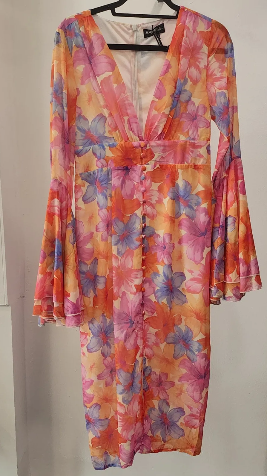 Floral Sunset Bell Sleeve Midi Dress in Sunset Bloom featuring plunge neckline, front slit and colorful floral print