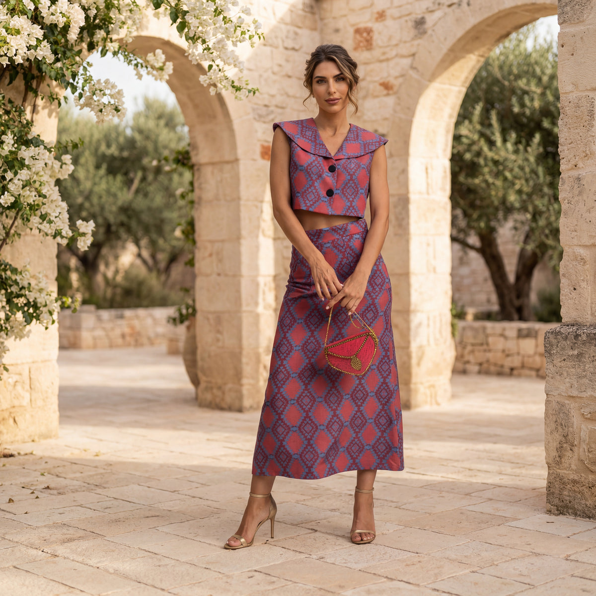 Fuchsia printed crop vest and midi skirt set styled in Mediterranean setting by MARIΓIOÚ